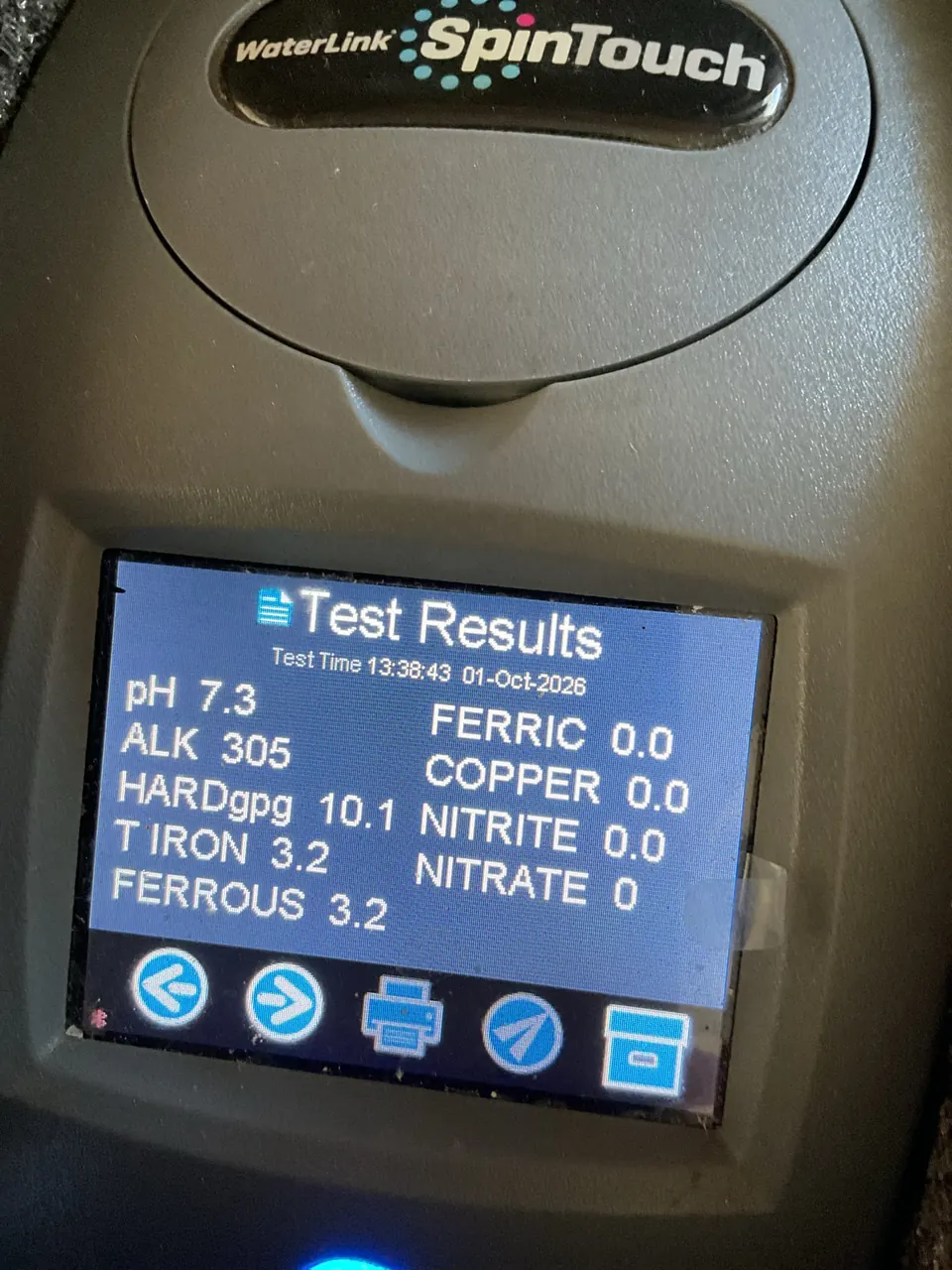 WaterLink SpinTouch water test results showing pH, alkalinity, hardness 10.1 grains, and iron 3.2 ppm